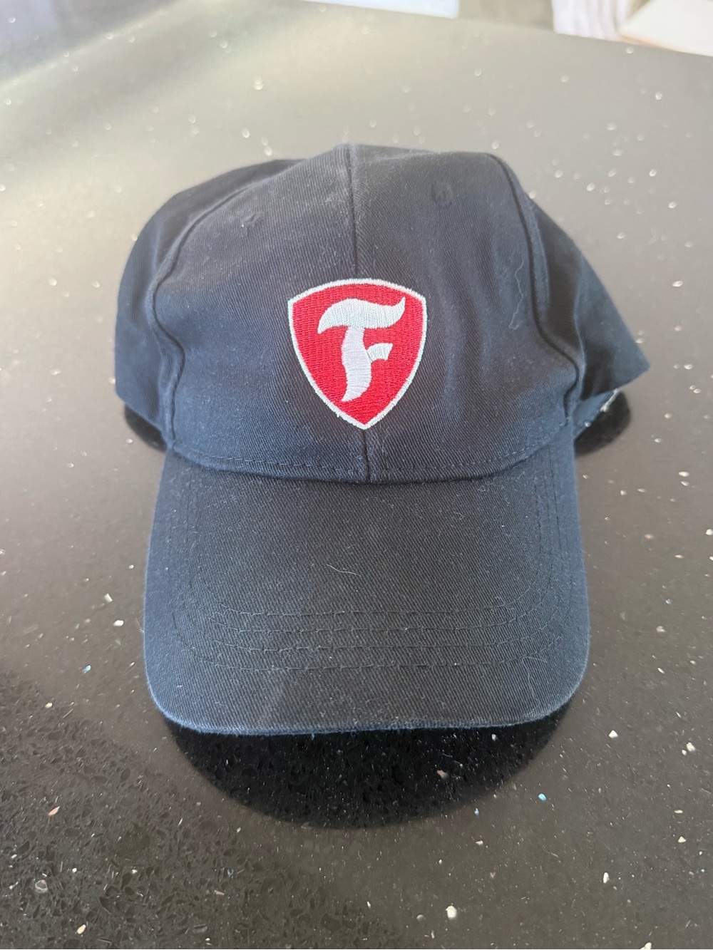 Firestone Black Baseball Cap with Red Shield Emblem